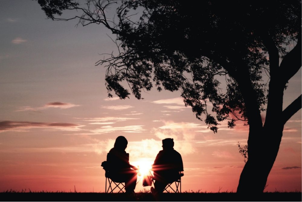two people watching the sunset